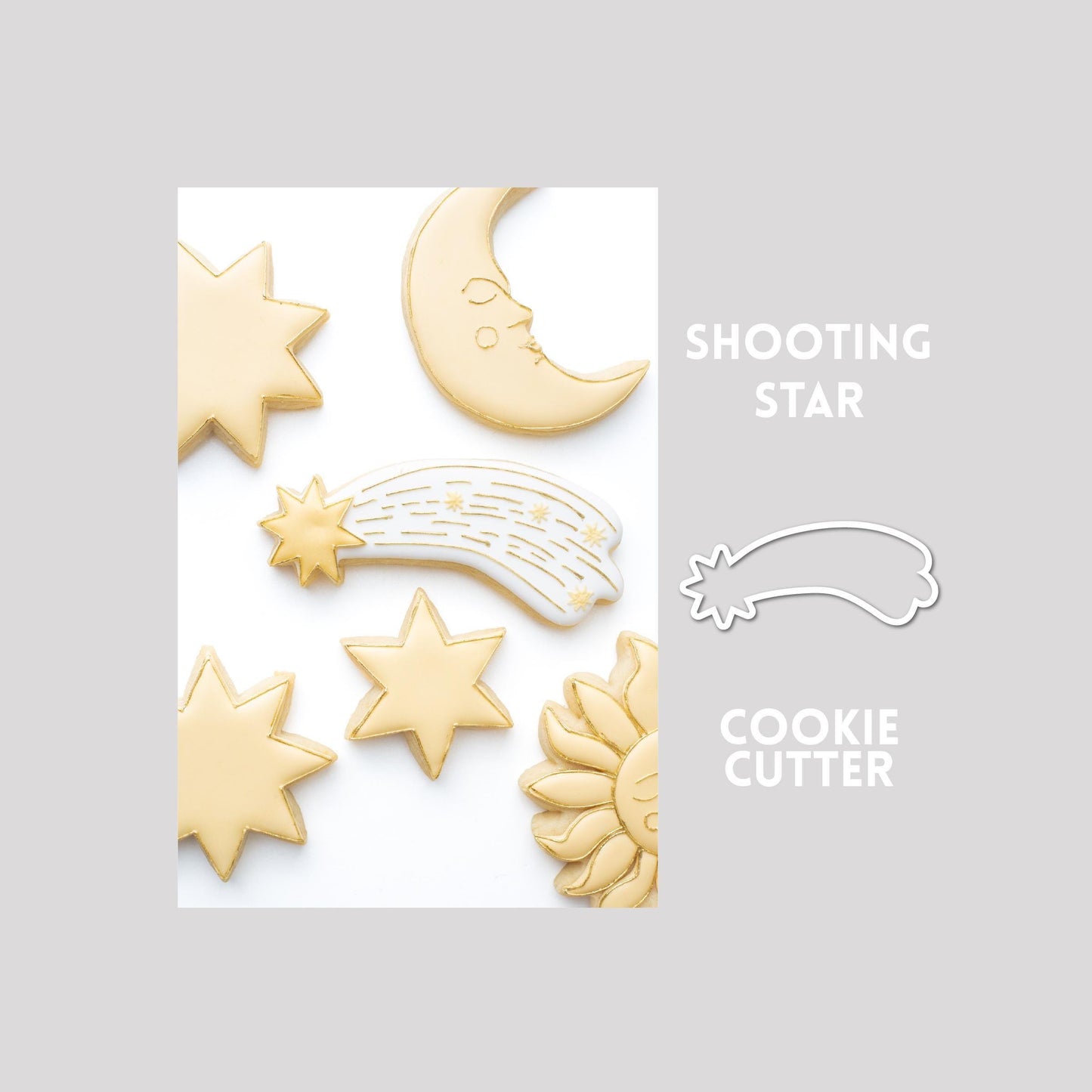 Decorated shooting star sugar cookie next to a shooting star cookie cutter outline on a gray background.