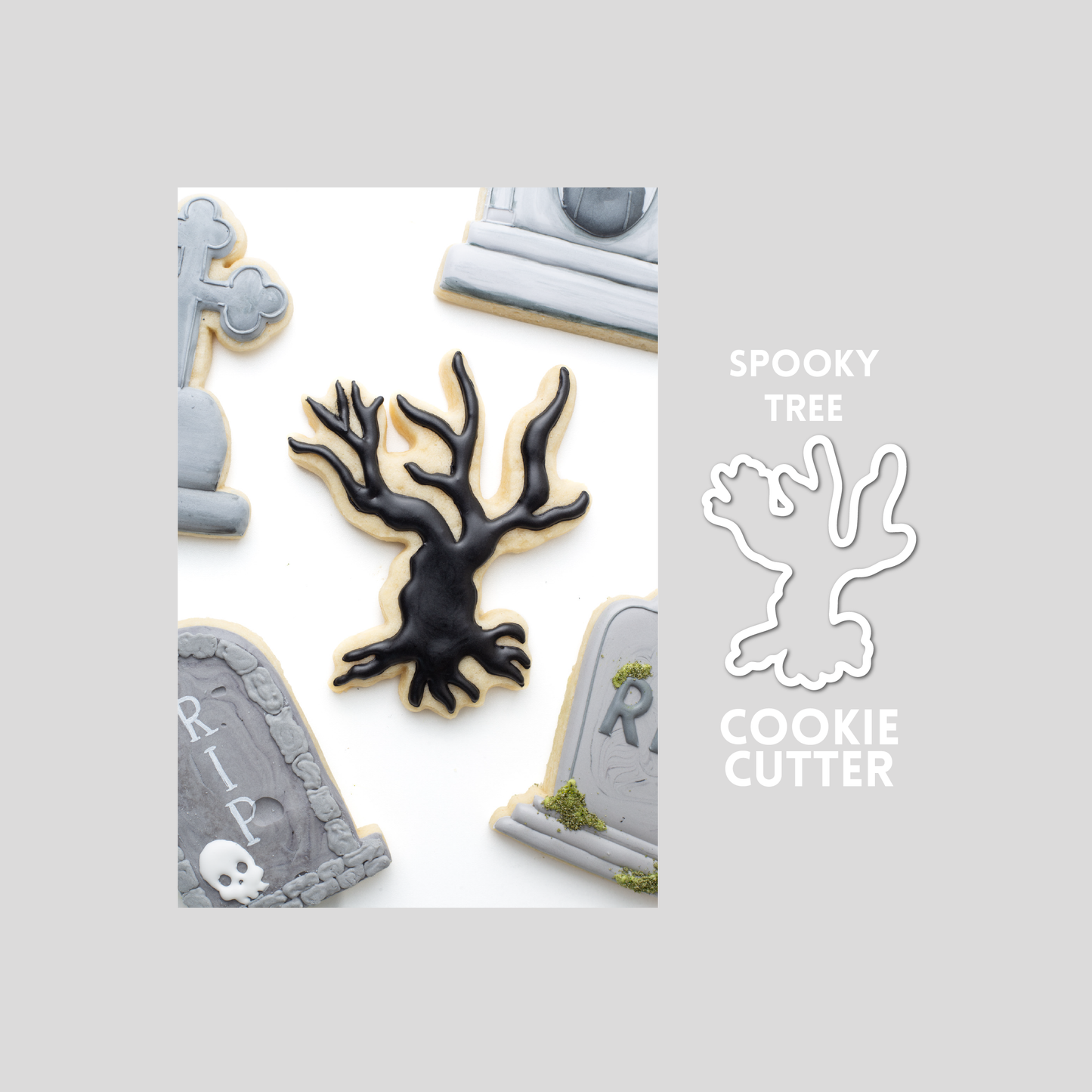 Decorated spooky tree sugar cookie next to a spooky tree cookie cutter outline on a gray background.