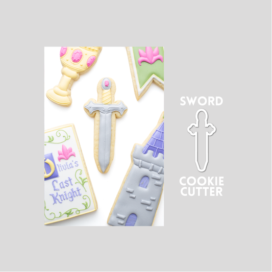 Decorated sword sugar cookie next to a sword cookie cutter outline on a gray background.